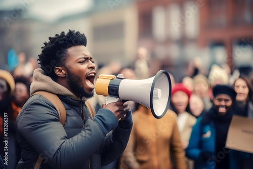 African male activist protesting via megaphone