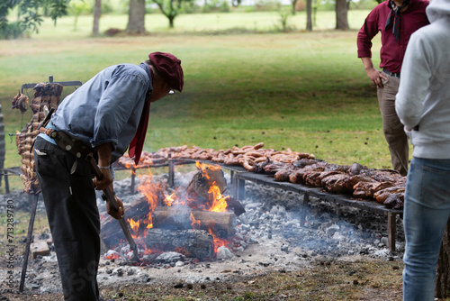 guacho roasting angus beef in the pampas countryside