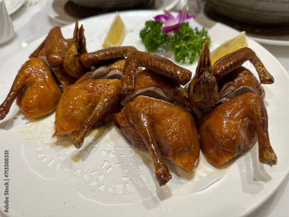 Traditional Cantonese roasted or grilled crispy pigeon Traditional Cantonese roasted or grilled crispy pigeon