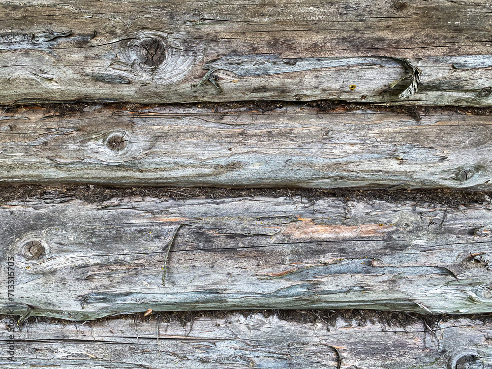 natural wooden background. wall made of old logs, place for an inscription natural wooden background. wall made of old logs, place for an inscription