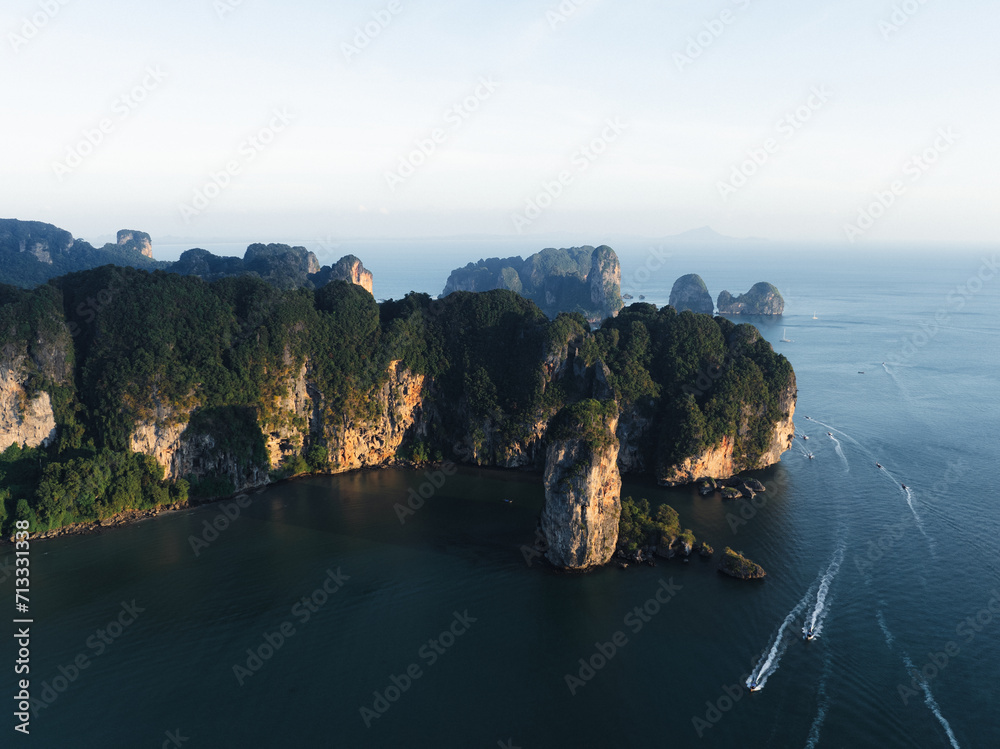 View from above, stunning aerial view of the Ao Nang coast at sunset with the Ao Nang Tower, Tonsai beach and Railay Beach in the distance, Krabi, Thailand.