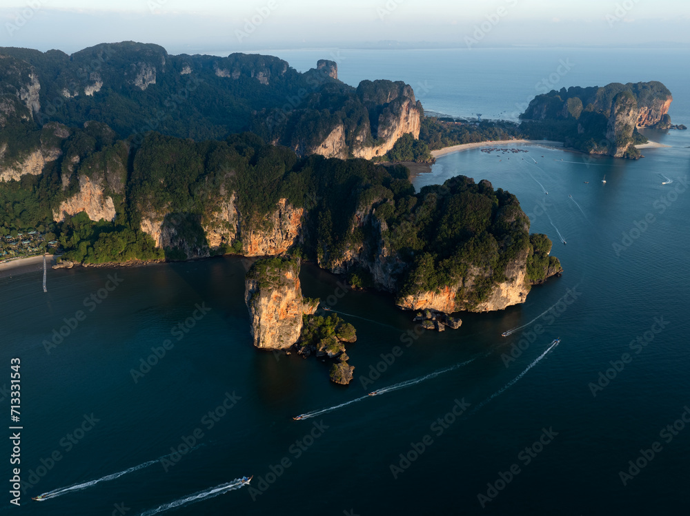 View from above, stunning aerial view of the Ao Nang coast at sunset with the Ao Nang Tower, Tonsai beach and Railay Beach in the distance, Krabi, Thailand.