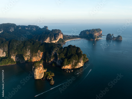 Obraz na płótnie View from above, stunning aerial view of the Ao Nang coast at sunset with the Ao Nang Tower, Tonsai beach and Railay Beach in the distance, Krabi, Thailand. w salonie