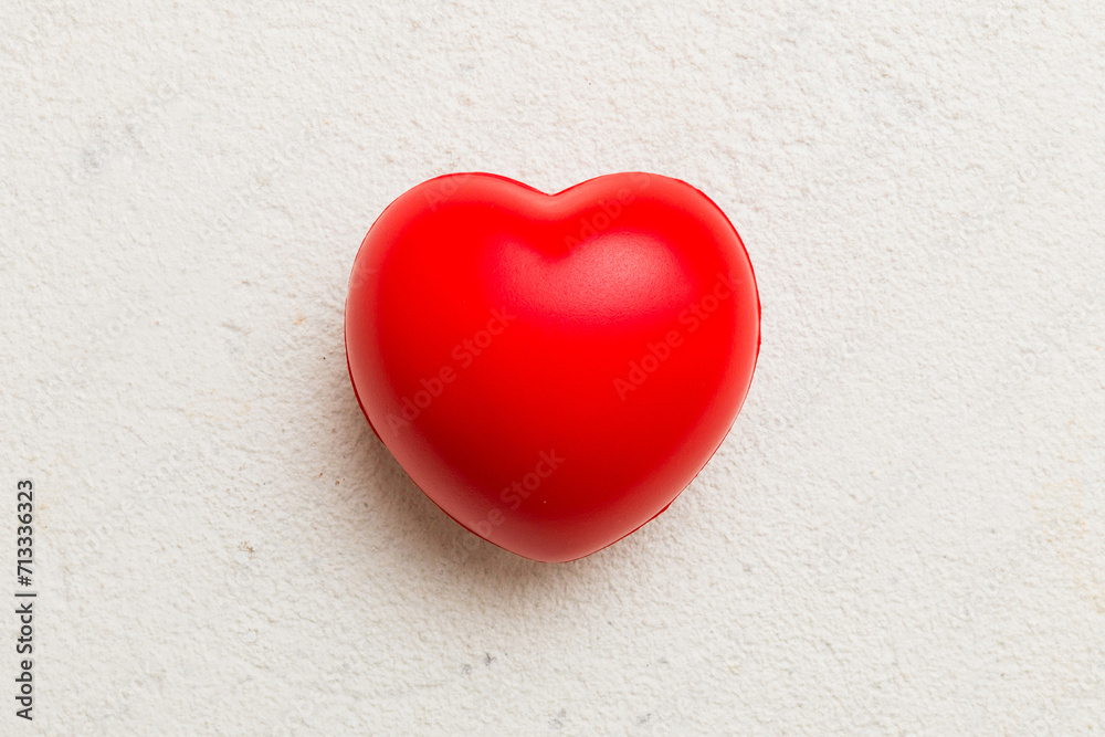 red heart shape on colored background. minimal concept top view with copy space red heart shape on colored background. minimal concept top view with copy space