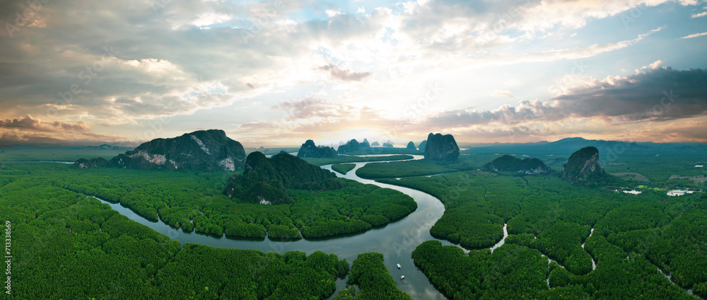 View from above, aerial shot, stunning panoramic view of Ao Phang Nga (Phang Nga Bay) National Park featuring a multitude of limestone formations rising from the sea. Thailand.