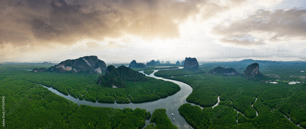 View from above, aerial shot, stunning panoramic view of Ao Phang Nga (Phang Nga Bay) National Park featuring a multitude of limestone formations rising from the sea. Thailand.