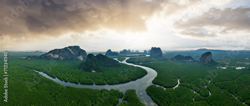 View from above, aerial shot, stunning panoramic view of Ao Phang Nga (Phang Nga Bay) National Park featuring a multitude of limestone formations rising from the sea. Thailand. photo