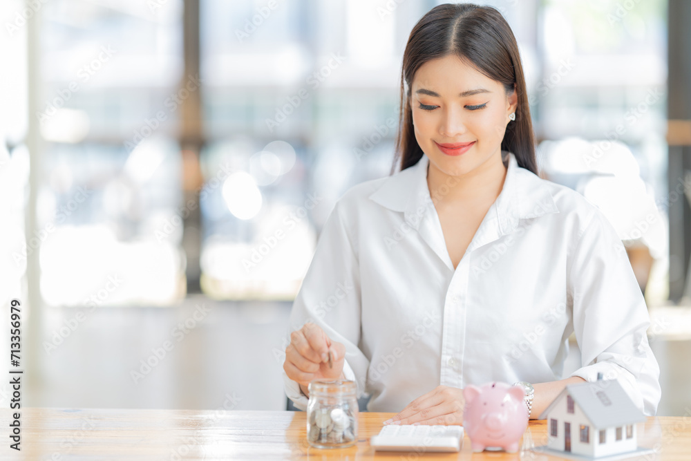 Portrait of beautiful young woman standing in front of glass board and smiling on camera. Female office worker using laptop in company. Portrait of beautiful young woman standing in front of glass board and smiling on camera. Female office worker using laptop in company.