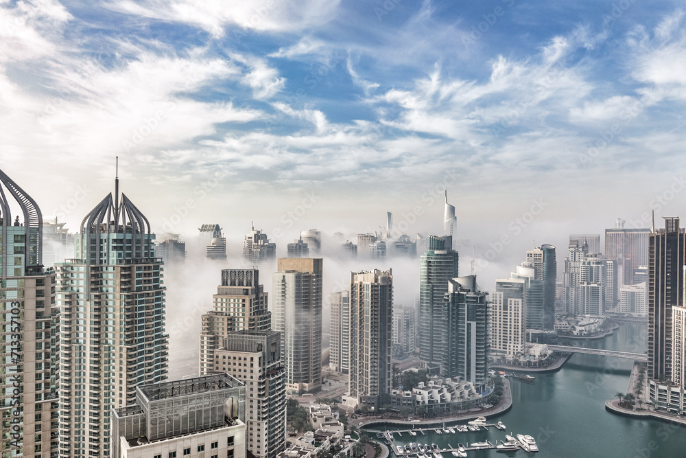 Dubai Marina's skyline embraced by ethereal fog