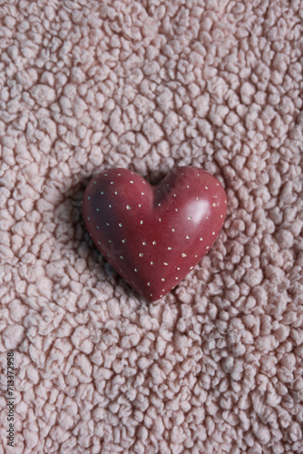 heart on a pink plush background.