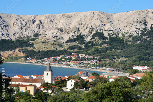 View of the Church of the Holy Trinity and Baska village and beach on the Island of Krk, Croatia