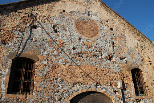 Fototapeta Naklejka Na Ścianę i Meble -  ruined stone warehouse (venitian arsenals) in chania in crete in greece 