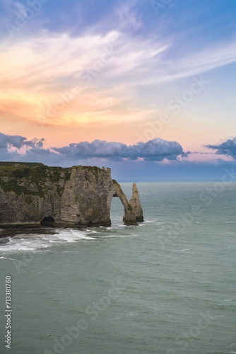 Etretat in Normandy  the famous cliffs and needle on the pebble beach 
