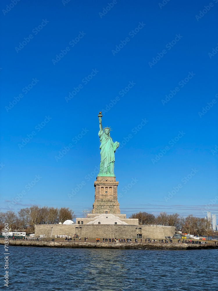 New York, New York – January 11, 2024: the view of the Statue of Liberty from the ferry boat with tourists