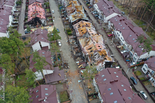 Hostomel, Kyev region Ukraine - 09.04.2022: Top view of the destroyed and burnt houses. Houses were destroyed by rockets or mines from Russian soldiers. Cities of Ukraine after the Russian occupation.