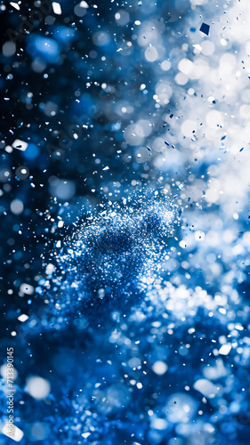 Closeup of an explosion of blue, black and white 3d particles