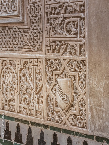 Shield of the Nazari kingdom of Granada. Arabic stone engraving in the Alhambra photo