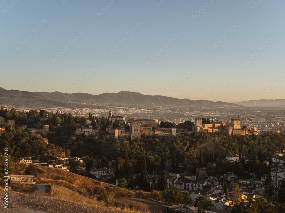 Panoramic view of the castle Alhambra in Granada, Andalusia, Spain, during sunset, from the Mirador de la Cruz de Rauda