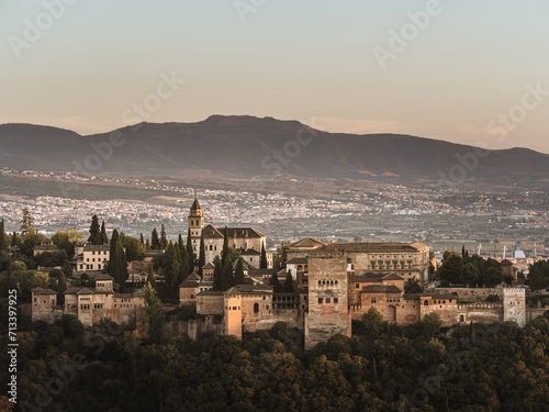 Panoramic view of the castle Alhambra in Granada, Andalusia, Spain, during sunset, from the Mirador de la Cruz de Rauda