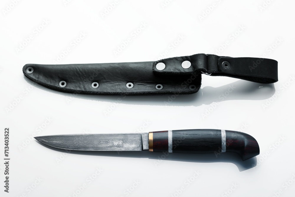 Handmade beautiful hunting knife with a sharp gray blade Handmade beautiful hunting knife with a sharp gray blade