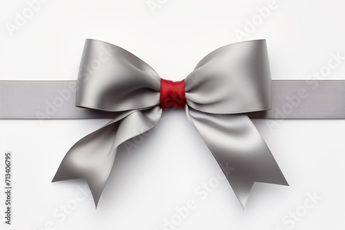Gray background adorned with a red ribbon and a tied bow