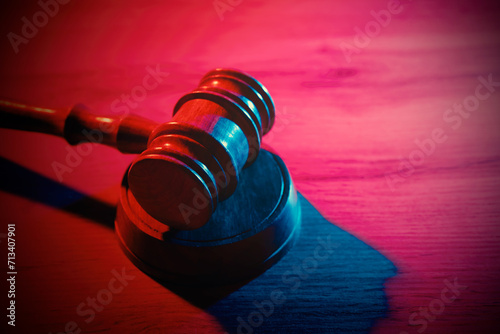 Wooden gavel on table, law concept photo