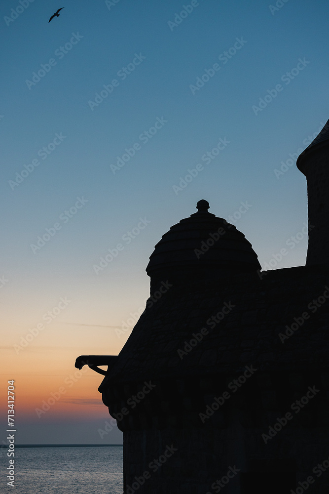 silhouette of a church at sunset, Le Mont-Saint-Michel at sunset