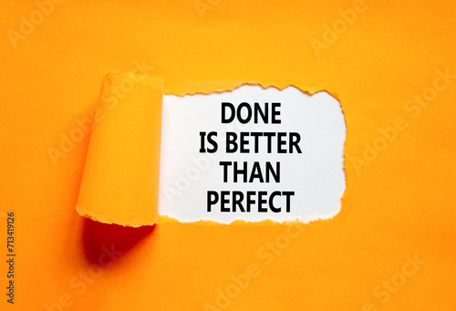 Done is better than perfect symbol. Concept words Done is better than perfect on beautiful white paper. Beautiful orange paper background. Business, done is better than perfect concept. Copy space.