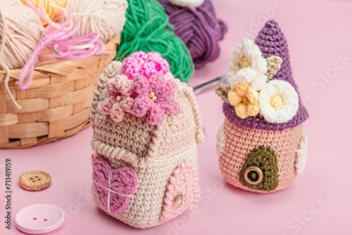Handmade spring decor concept. Creative crocheting, house figurines, traditional flowers and stuff