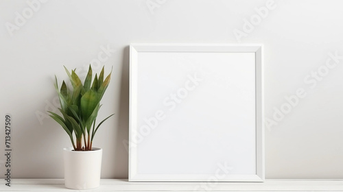 Blank white frame with plant pot isolated mock up on white background  © Johannes