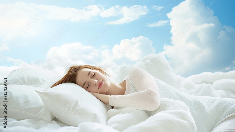 Beautiful young woman with a smile sleeps on a bed with a soft white dazzling blanket and pillows that float in the clouds against the background of a blue bright sky - obrazy, fototapety, plakaty 