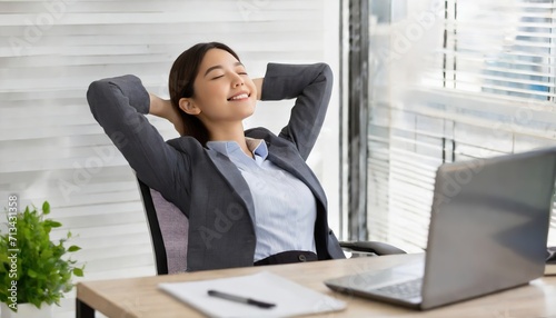 Calm businesswoman office worker holding hands behind head finished computer work at workplace.ai generated photo