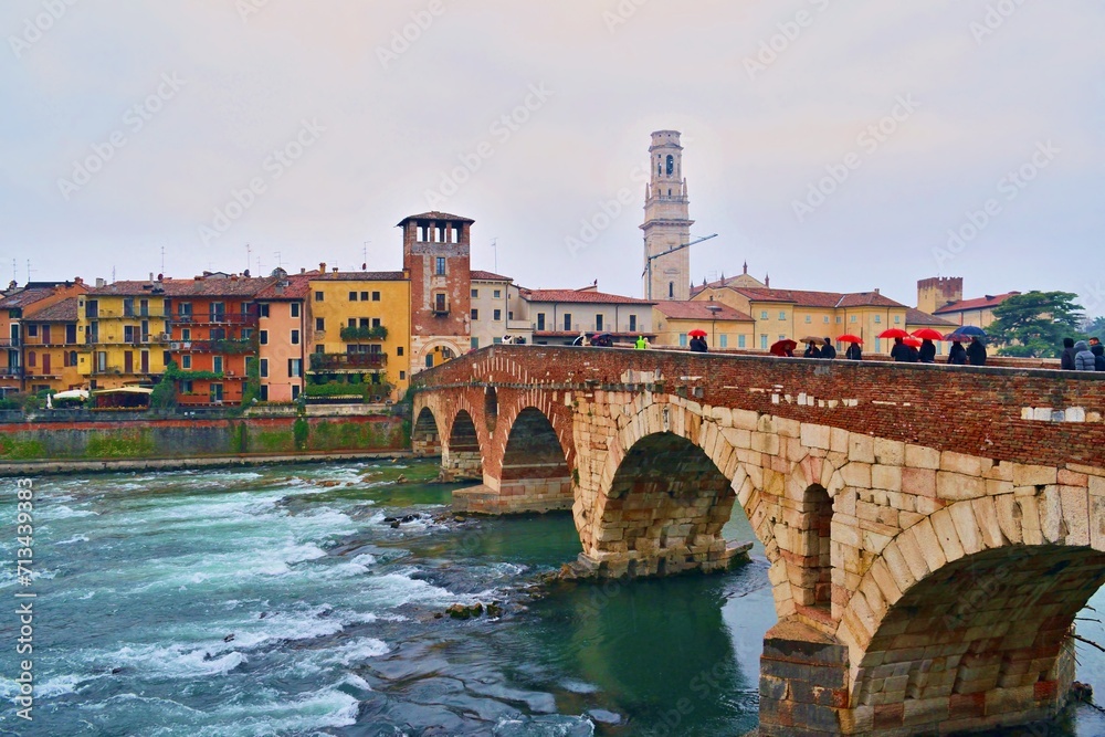 view of the ancient Ponte Pietra over the Adige river in the city of Verona, Italy