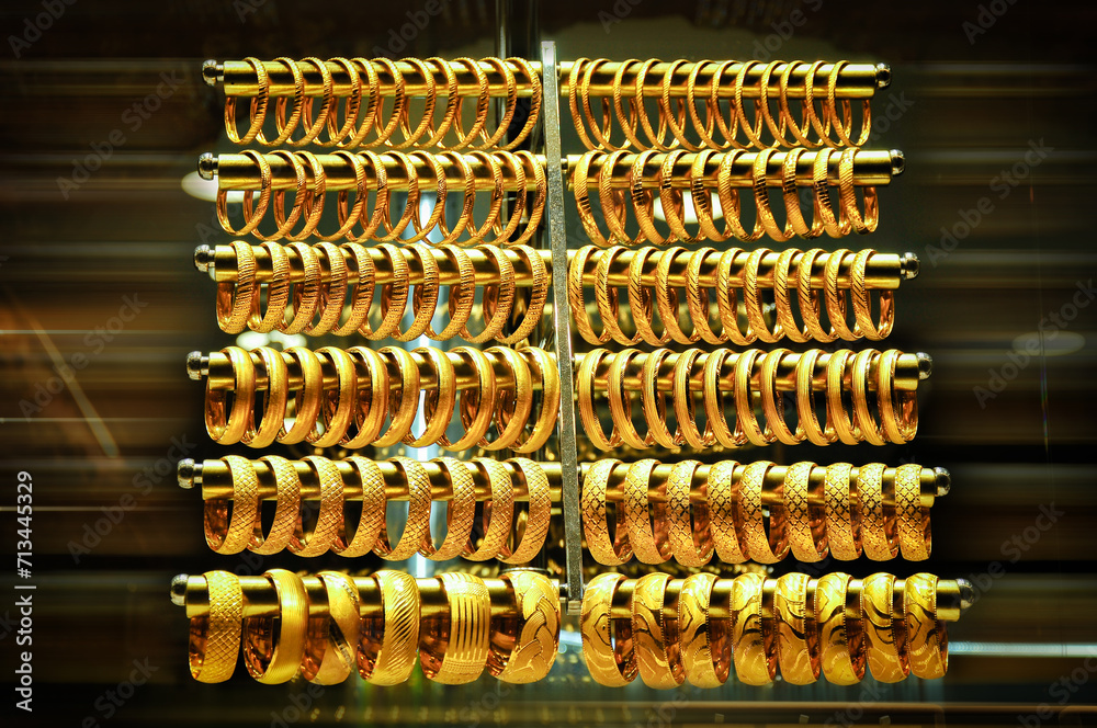 Gold bracelets in the jewelry store window. Gold bracelets in the jewelry store window.