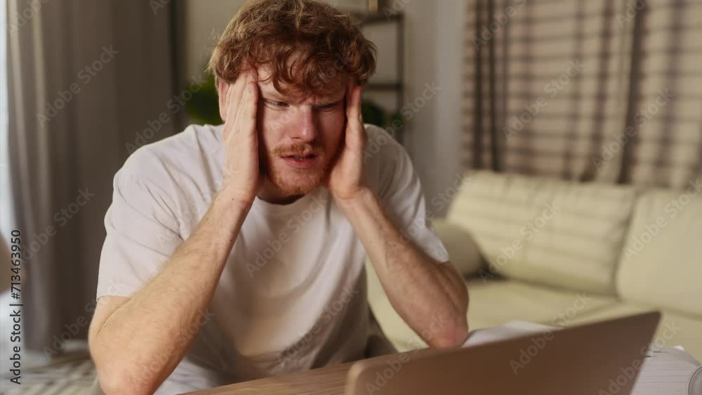 Tired young red hair student or freelancer feel stress during study or work at home workplace Exhausted ginger male with remote distance work or education hard program indoors Tired young red hair student or freelancer feel stress during study or work at home workplace Exhausted ginger male with remote distance work or education hard program indoors