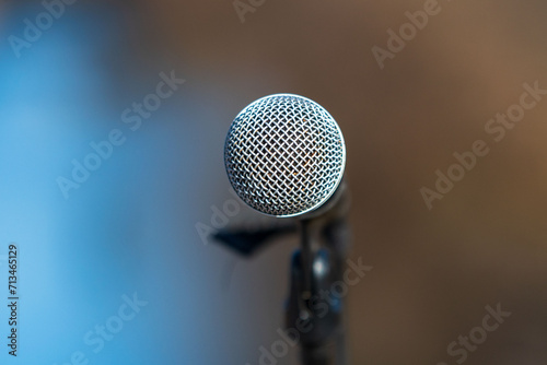 Microphone head, blurry nature, background. Blue and brown. Colors. Pattern and texture.