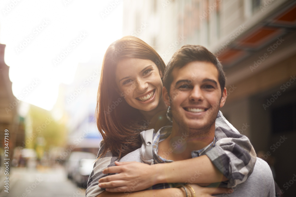 Love, portrait and happy couple hug, piggyback and together for outdoor date, bonding and fun in new city. Wellness, happiness and face of gen z man, woman or people smile for relationship commitment