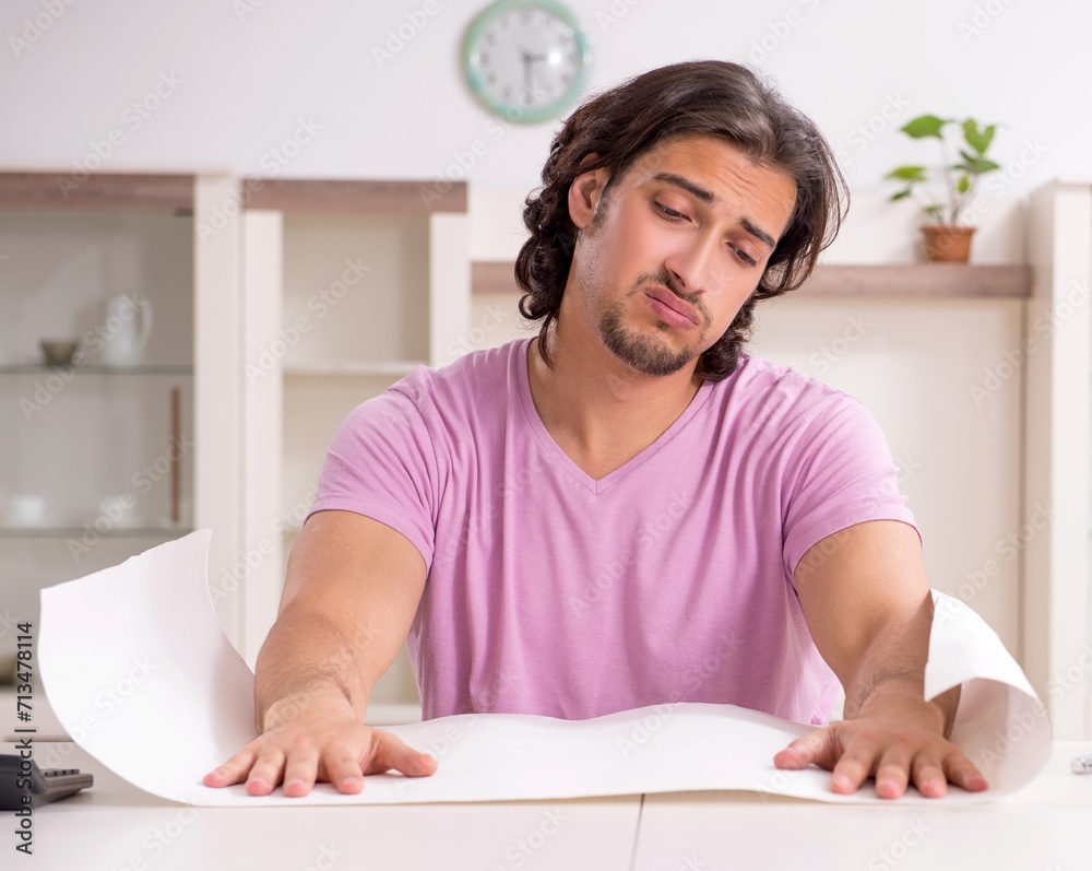 Young male architect student preparing for exams at home Young male architect student preparing for exams at home
