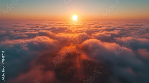Fényképezés Breathtaking aerial view of a sunrise above the clouds with trees