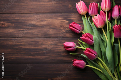 tulips on a wooden table, flat lay, card for Mother's Day or Valentine's Day. Copy space for text