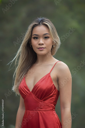 Asian woman in red silk dress