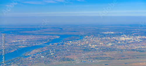 Aerial view of Astrakhan city, Russia out of focus seen from an airplane. Panorama