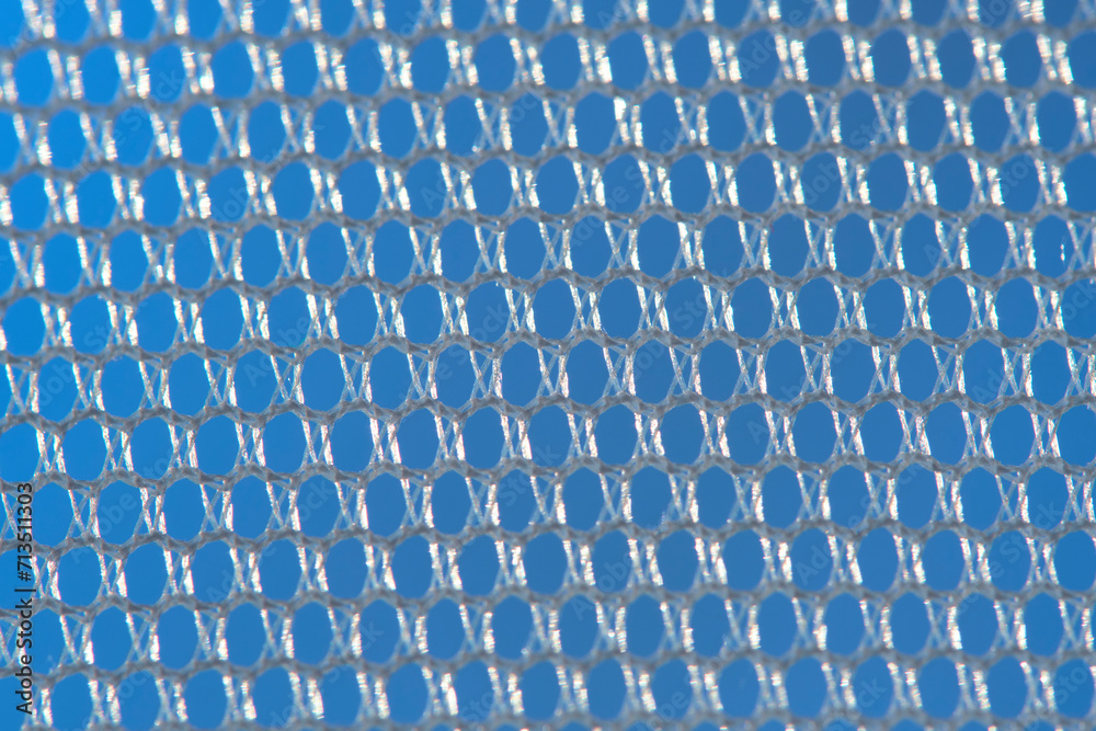 Naklejka premium Background is an abstraction macro image white tulle.