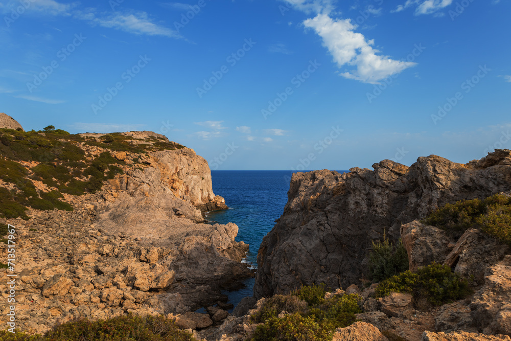 Seaside landscape - view of rocks and green plants on the island of Rhodes Greece. Seaside landscape - view of rocks and green plants on the island of Rhodes Greece.