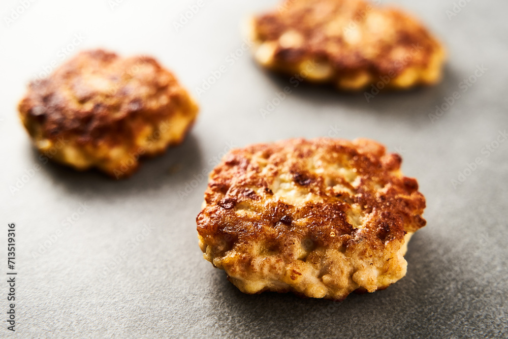 Golden Brown Chopped Chicken Cutlets or Patties with mozzarella cheese on concrete background. Golden Brown Chopped Chicken Cutlets or Patties with mozzarella cheese on concrete background.