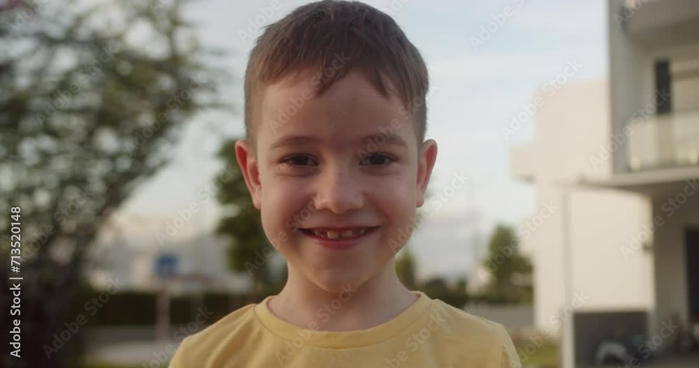 Child boy smiling to camera portrait, happy portrait kid, Caucasian handsome boy smile in sunlight outdoors. 4K Child boy smiling to camera portrait, happy portrait kid, Caucasian handsome boy smile in sunlight outdoors. 4K