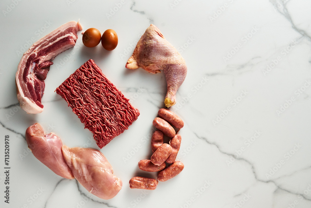 Carnivore diet or low carb diet background concept. Raw animal meat