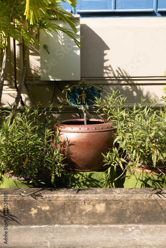 Potted Planter in the Center of a Garden