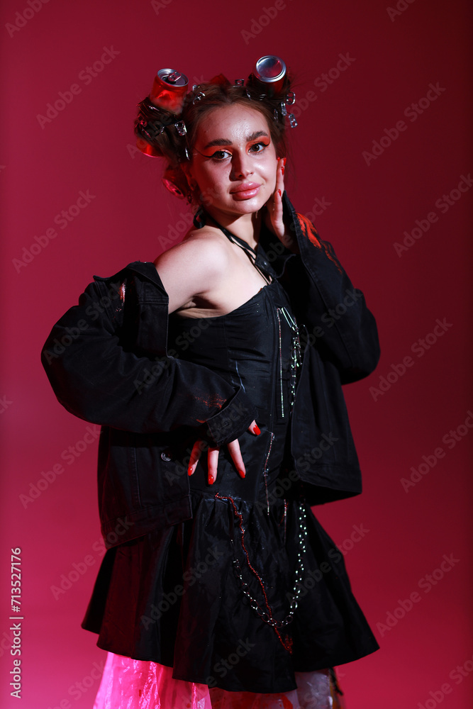 Young woman in black jacket on pink background Young woman in black jacket on pink background