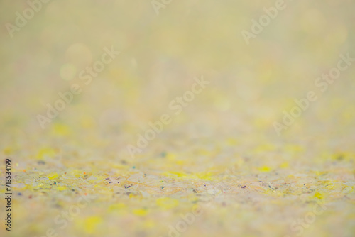 Yellow and beige background with thin focal part and defocus lights. Abstract background.